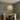 Banded Rattan Globe Pendant Light | Natural Woven Hanging Lamp – switched on in a room