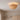 Scalloped Rattan Flush Mount Ceiling Light | Woven Shell Fixture – switched on in a room