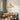Spiral Rattan Cone Pendant Light | Handwoven Bamboo Hanging Lamp – switched on in a room