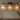 Three-Light Clear Glass Vanity Light | Black and Brass Bath Fixture – close-up