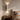 Travertine Cylinder Wall Light | Natural Stone Up-Down Sconce – switched on in a room
