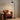 Wood-Accent Metal Cone Floor Lamp | Curved Nordic Standing Light – switched on in a room