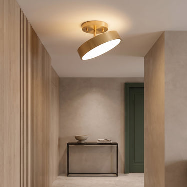 Adjustable Copper Flush Mount Light | Small Gold LED Ceiling Spot – switched on in a room