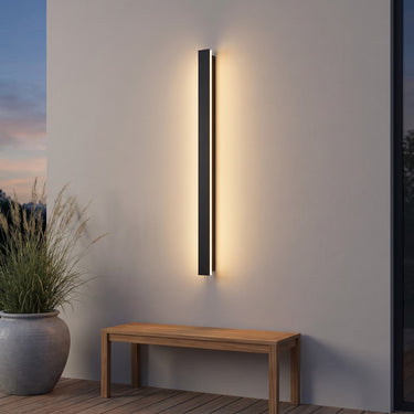 Black Linear Outdoor Wall Sconce | Waterproof LED Bar with Remote Option – switched on in a room