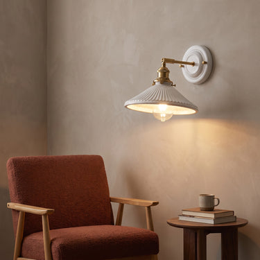 Ceramic and Brass Vintage Wall Sconce | Classic Single-Light Wall Lamp – switched on in a room