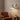 Ceramic and Brass Vintage Wall Sconce | Classic Single-Light Wall Lamp – switched on in a room