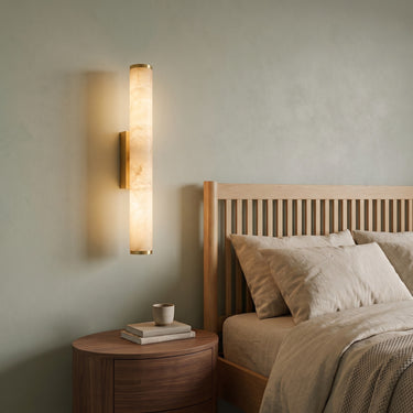Marble-Look Resin Wall Sconce | Sculptural Warm LED Wall Light – switched on in a room