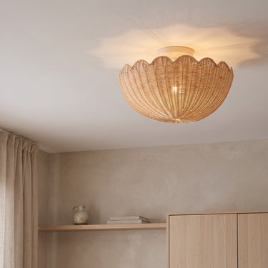 Scalloped Rattan Flush Mount Ceiling Light | Woven Shell Fixture – switched on in a room