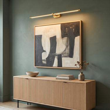 Slim Linear Wall Light | Gold LED Vanity and Picture Light – switched on in a room