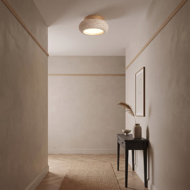 Small Travertine Disc Ceiling Light | Compact Wood and Stone LED – switched on in a room