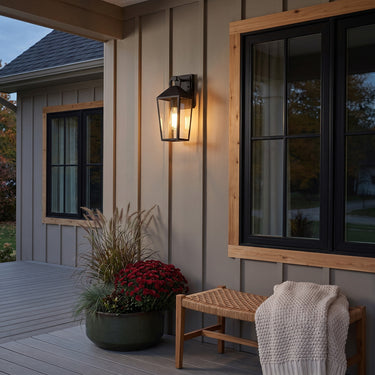 Tapered Glass Lantern Outdoor Wall Light | Classic Matte Black Porch Light – switched on in a room