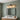 Three-Light Clear Glass Vanity Light | Black and Brass Bath Fixture – switched on in a room