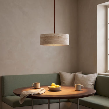 Travertine Cylinder Pendant Light | Wabi-Sabi Stone Hanging Lamp – switched on in a room